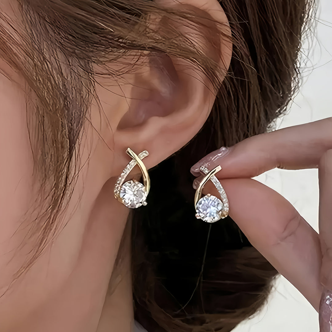Stud earrings with gold cross and zirconia stones