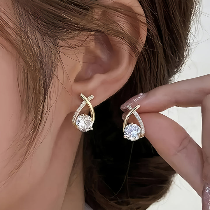 Stud earrings with gold cross and zirconia stones