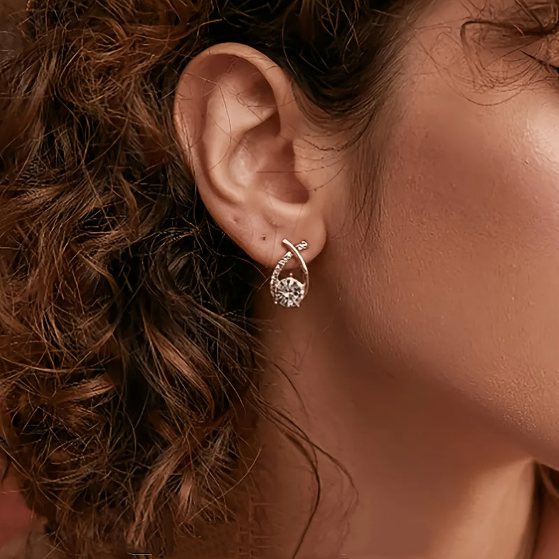 Stud earrings with gold cross and zirconia stones