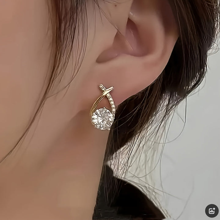 Stud earrings with gold cross and zirconia stones